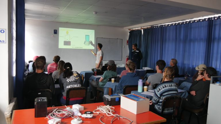 volunteers learning about installation solar panels