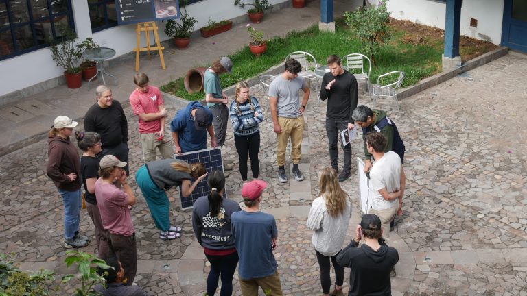 volunteers installing solar panels