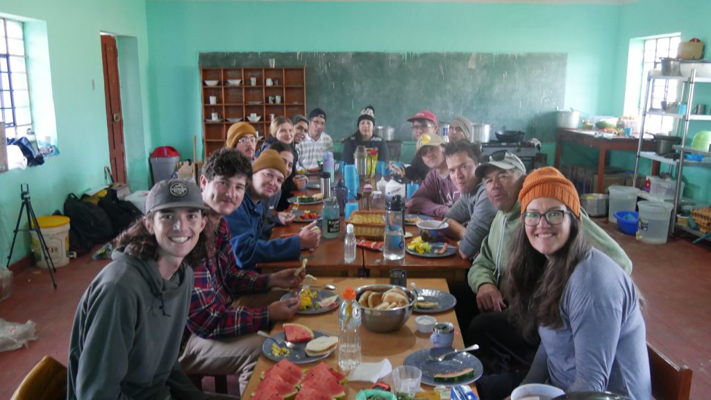 volunteers eating after solar panels installation