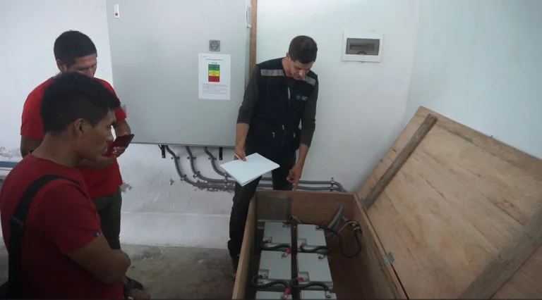 Local technicians inspecting a solar-powered production plant in Soledad, Peru