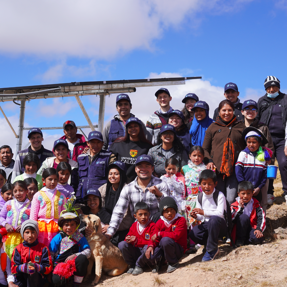 UofC group with LUTW under the 6 panel array installed for the elementary school
